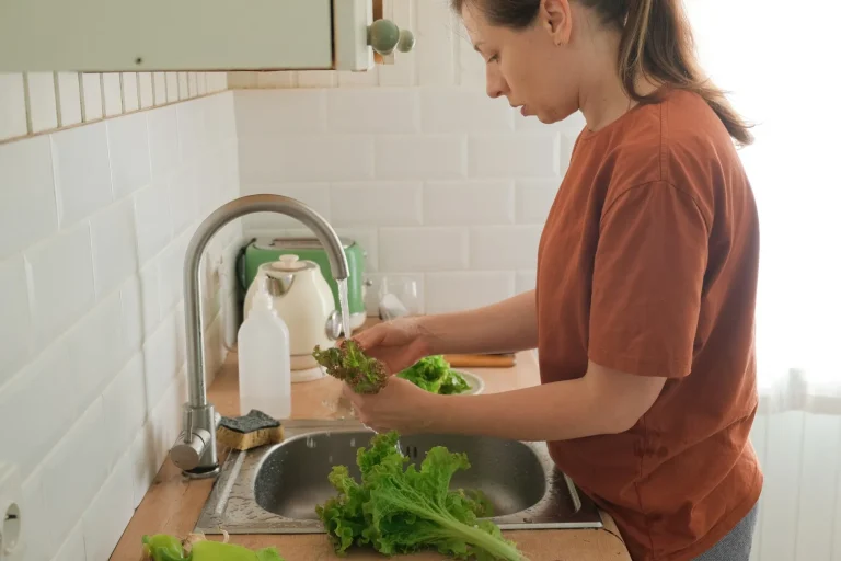 Woman cleaning lettuce