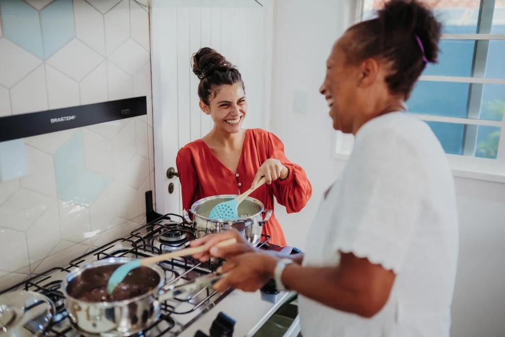 Two people cooking in kitchen