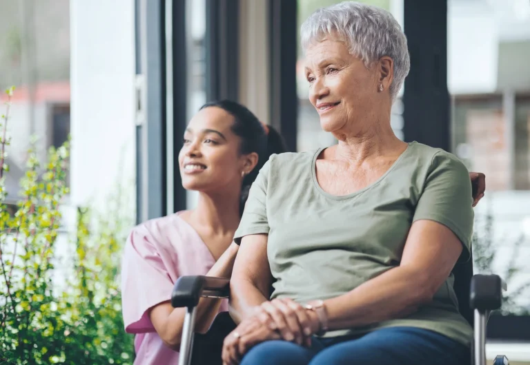 Nurse with woman in wheelchair