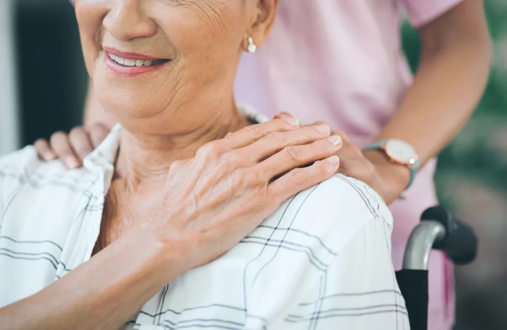 Nurse with elderly woman in wheelchair